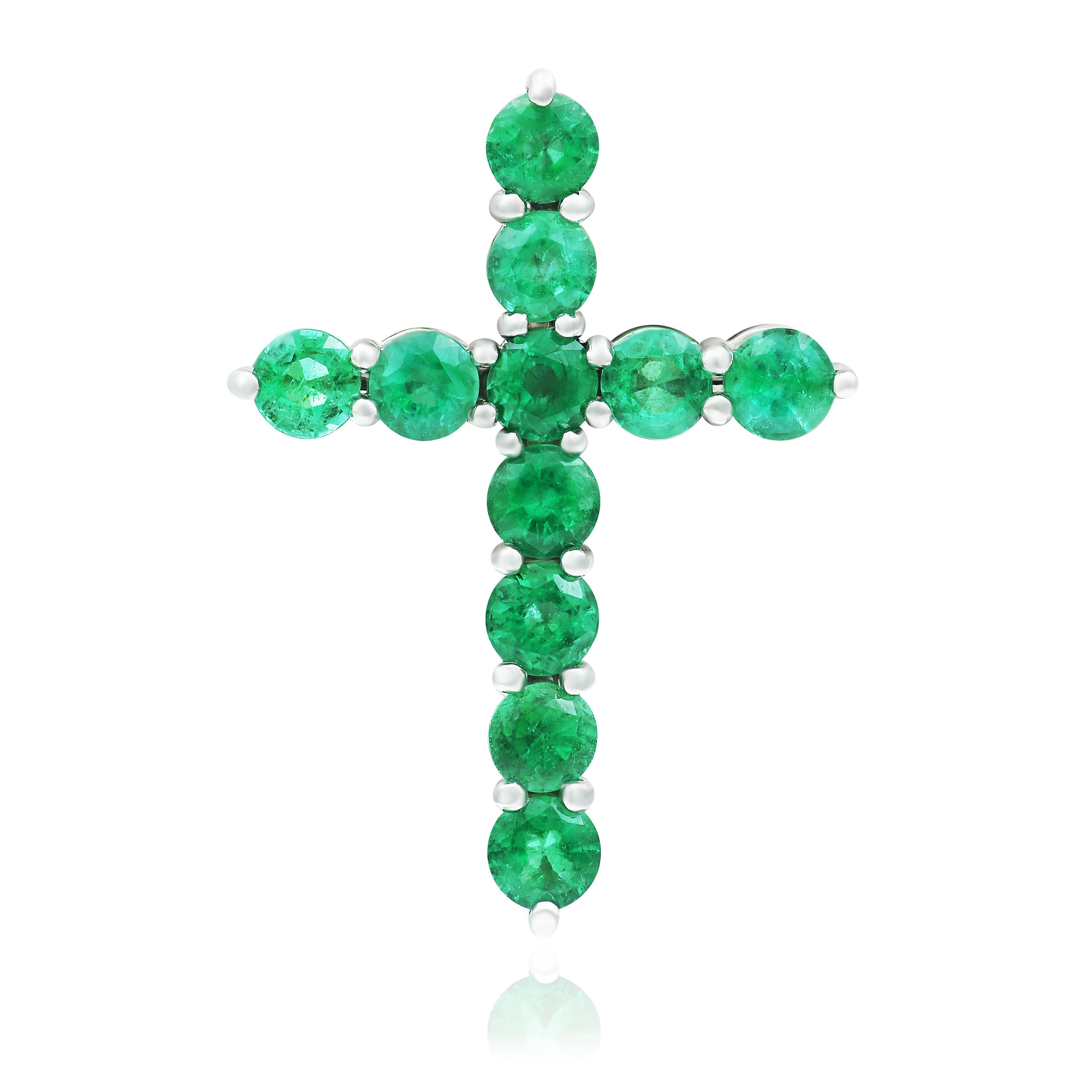 Крест из белого золота с изумрудами
